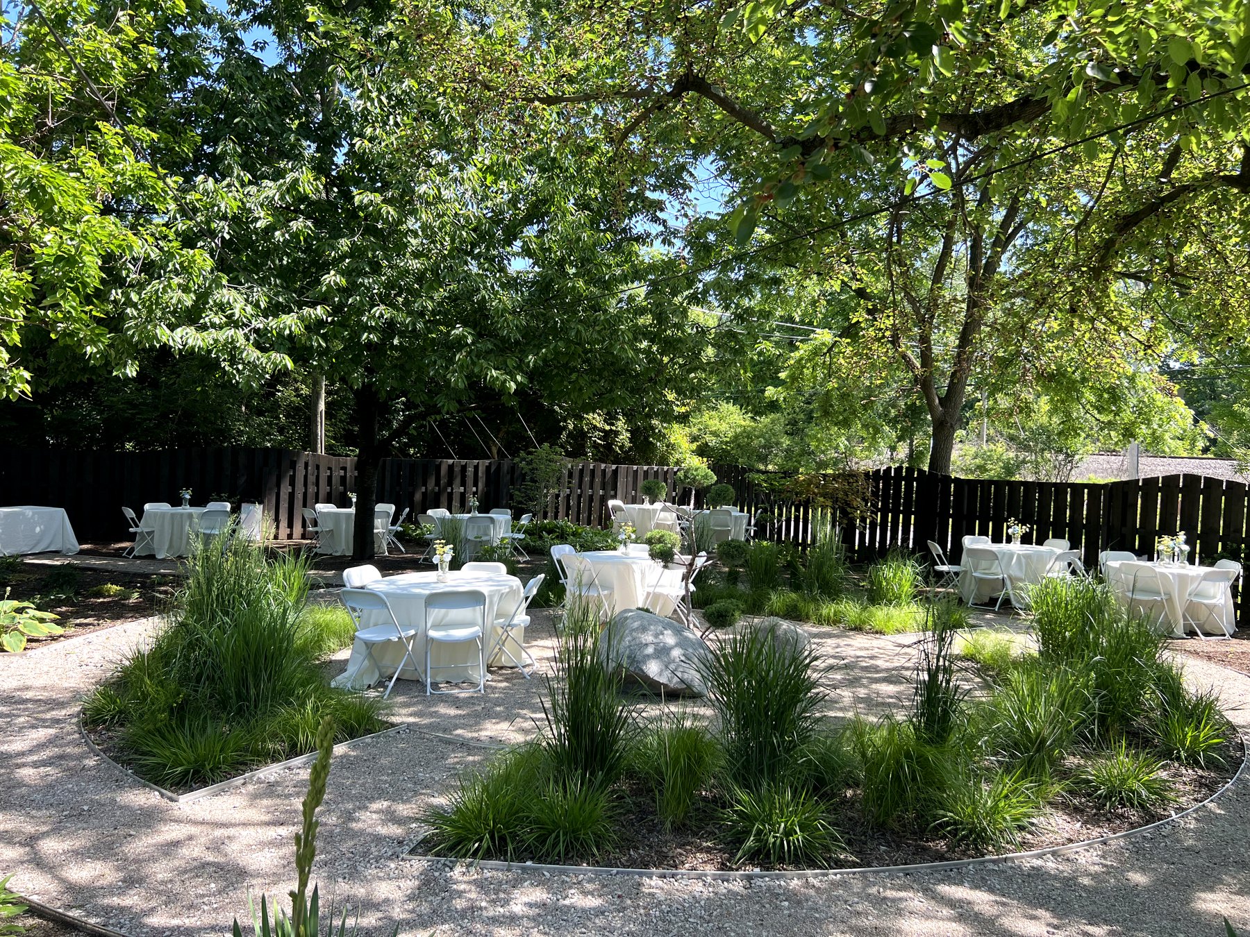 Indigo Sun garden courtyard set with white event tables